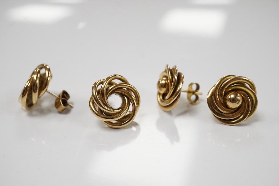 Two pairs of 9ct gold stud earrings, each of knot design, each pair 1.5cm diameter, post fittings, British hallmarks, combined gross weight 9 grams